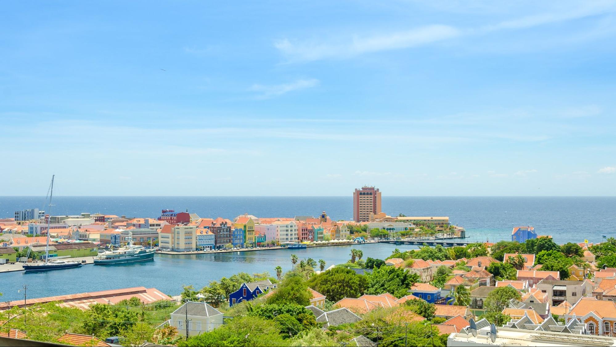 View of Willemstad downtown with colorful facades in Handelskade Curacao