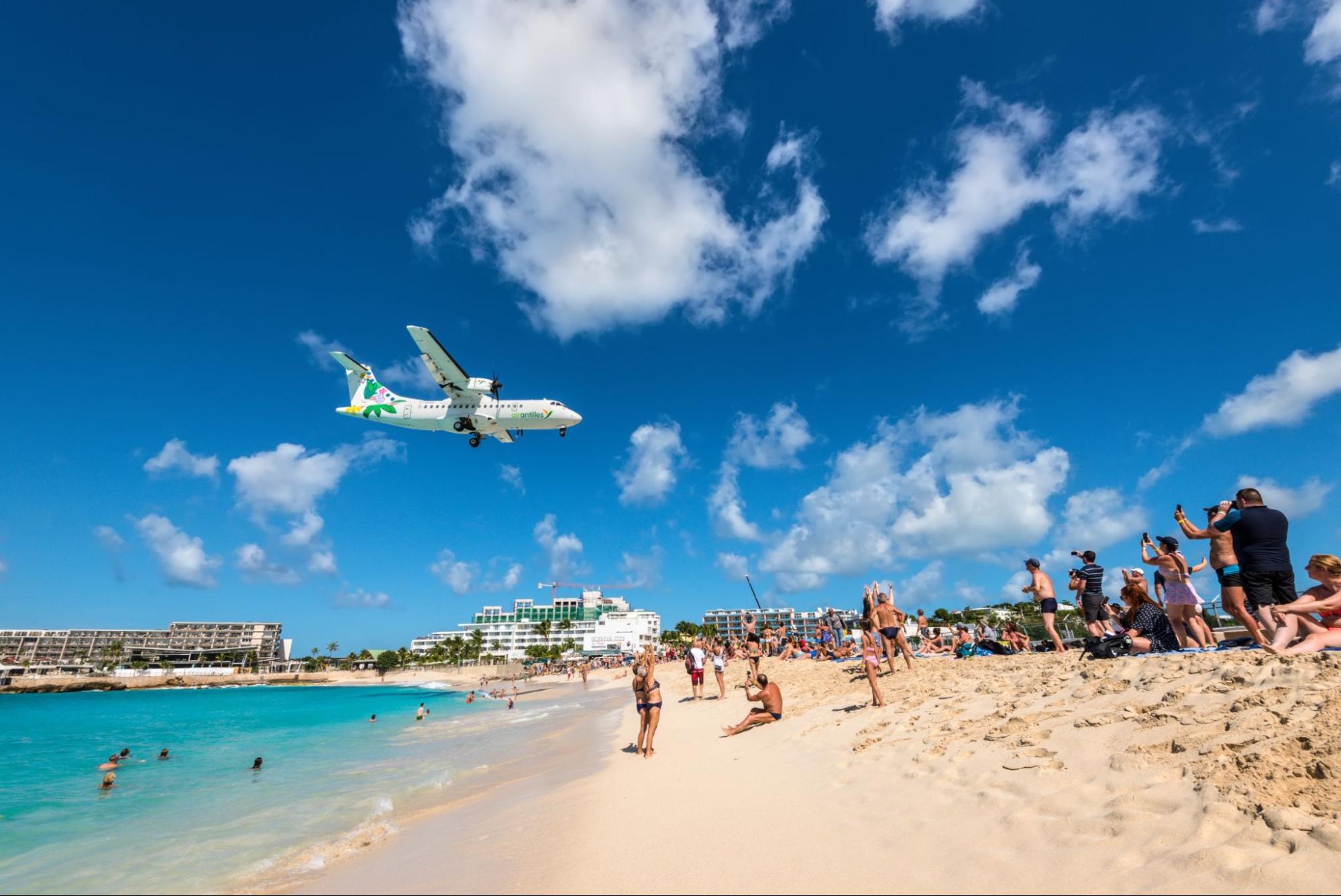The short runway gives beach goers close proximity views of the planes